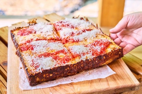 Pizza Oven Detroit Pizza on a cutting board - select to zoom