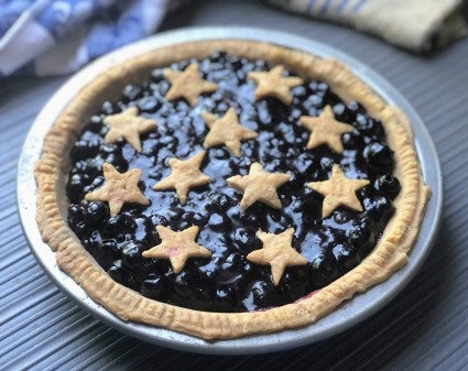 Fresh blueberry pie showing how its crust, when baked upside down, remained atop the pie paln's rim, instead of slumping down the sides of the pan.