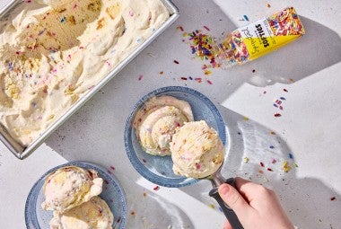 Birthday Cake Ice Cream being scooped into a dish