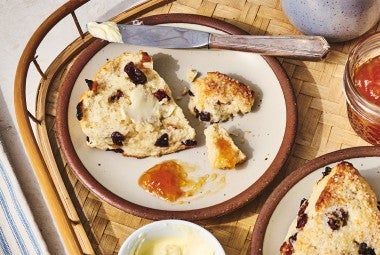 A Cream Tea Scones broken up on a plate