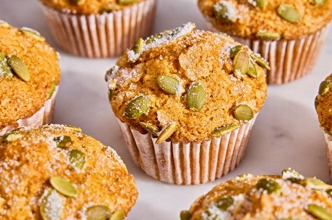 A bunch of Easy Pumpkin Muffins on a table - select to zoom