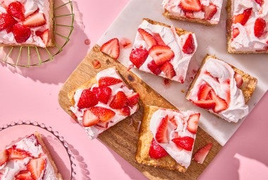 Giant Strawberry Shortcake sliced on a cutting board