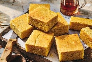 Pieces of Maple Cornbread on a cutting board