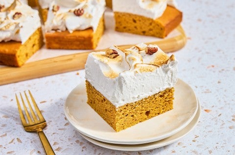 A slice of Sweet Potato Sheet Cake with Marshmallow Frosting on a plate