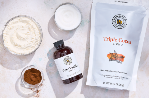 Ingredients to make Small-Batch Chocolate Cupcakes that include King Arthur Baking Vanilla and King Arthur Baking Triple Cocoa powder. - select to zoom